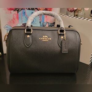 Coach Rowan black new w/tags  Retails $490.        L"10.0" H: 6.5" W: 5.5"